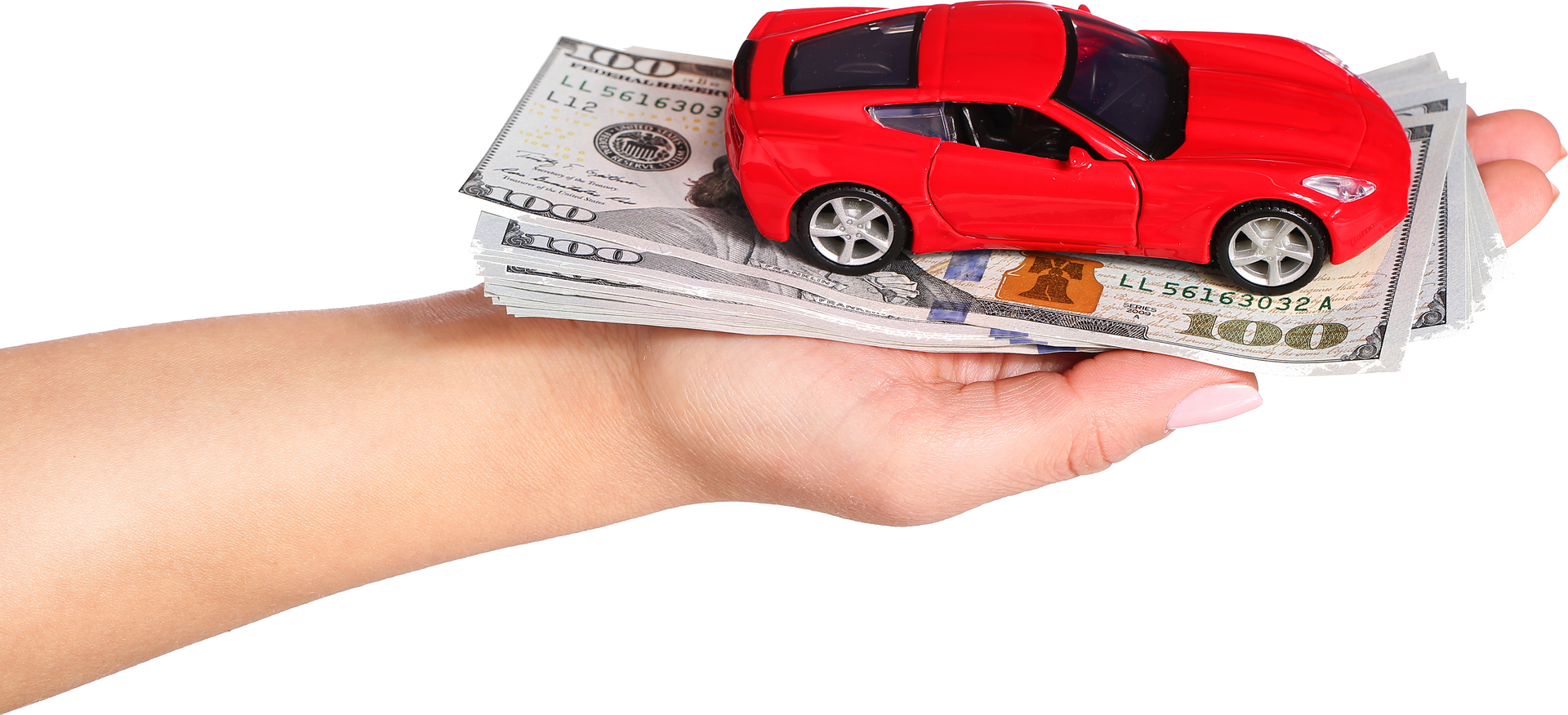 A hand is holding a red toy car and a stack of money.
