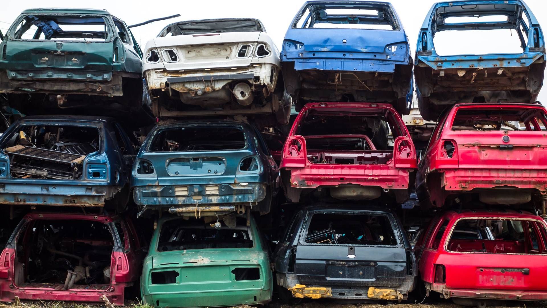 A bunch of cars are stacked on top of each other.
