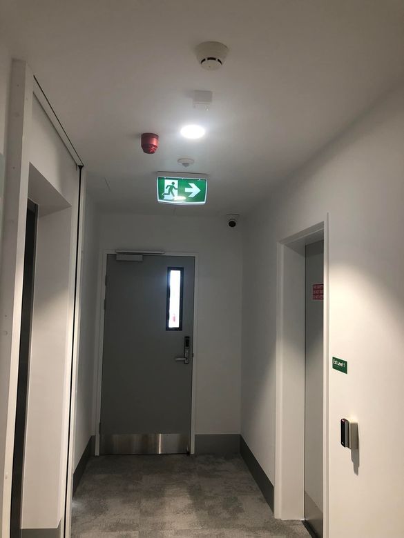 Modern Building With Red Screen and Angled Black Window — EBS NQ Electronic Building Systems in Kirwan, QLD