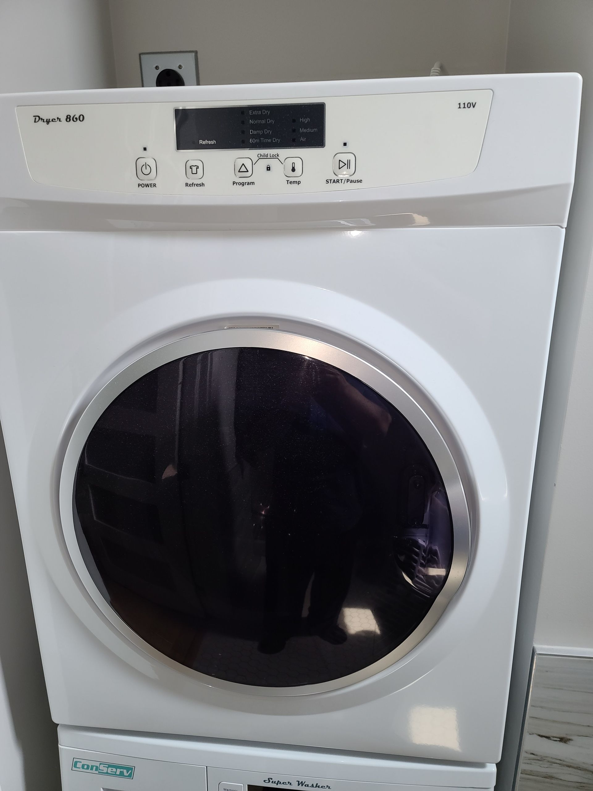 A large house with a garage and a driveway in front of it.