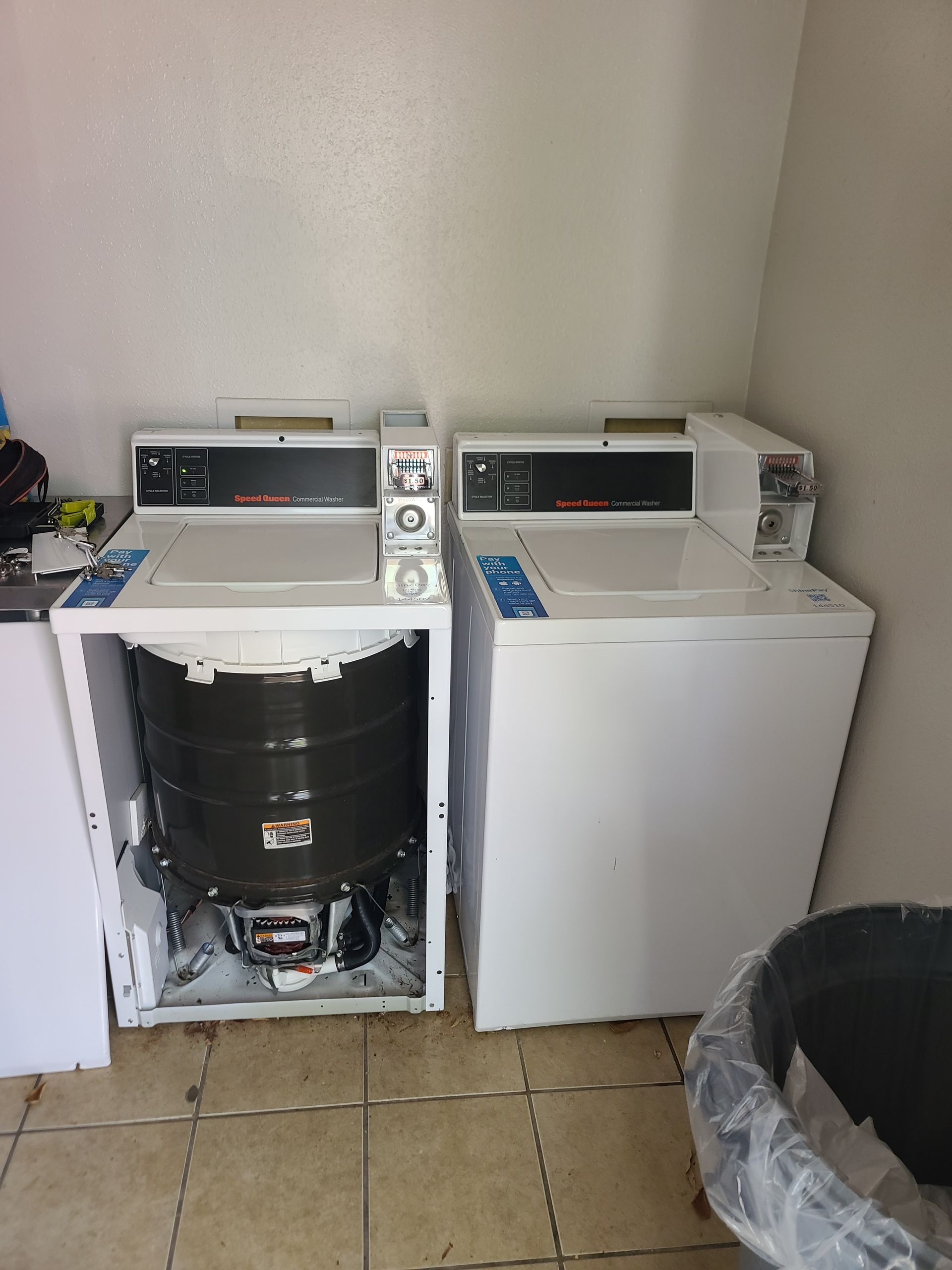 A large house with a lot of windows and a garage on a rainy day.