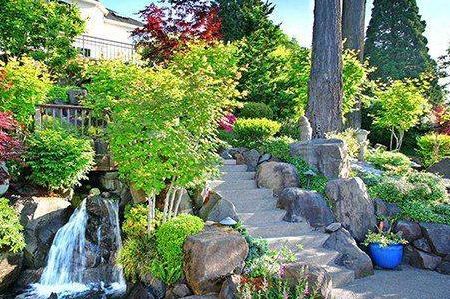 There is a waterfall in the middle of the garden.
