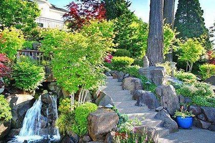 There is a waterfall in the middle of the garden.