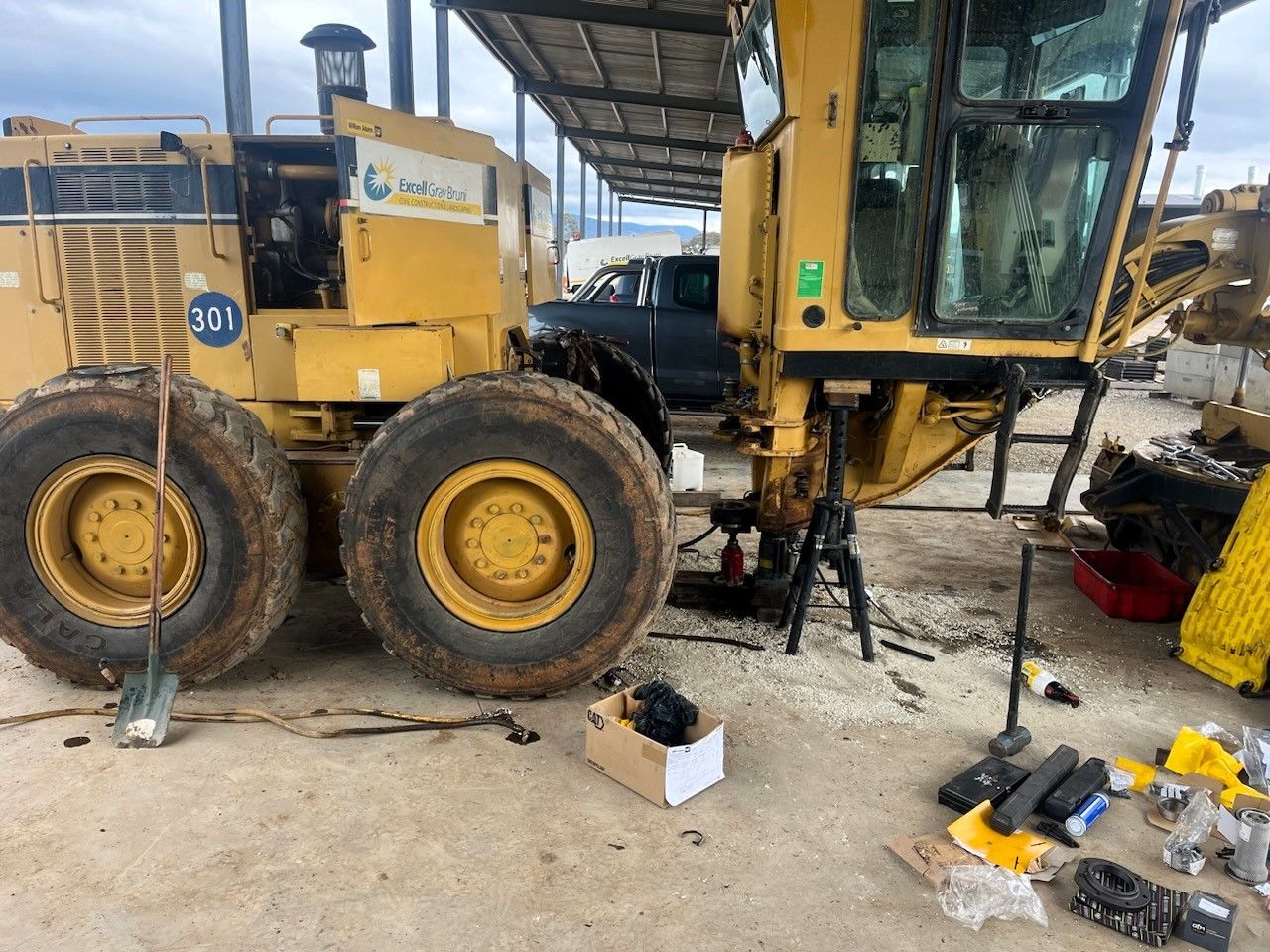 A Yellow Heavy Machine With Tools Around It In A Garage — Wyatt Mechanical Pty Ltd In Wodonga, VIC
