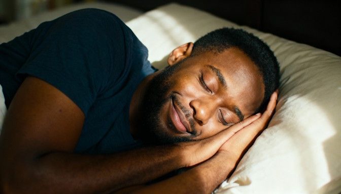 Dayton resident peacefully sleeping in soft morning light, relaxed smile