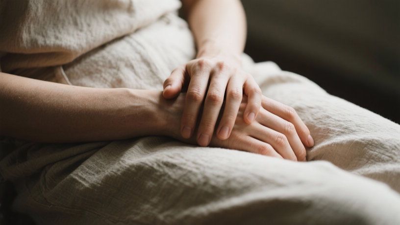 Dayton clients hands sitting in a resting calm posture