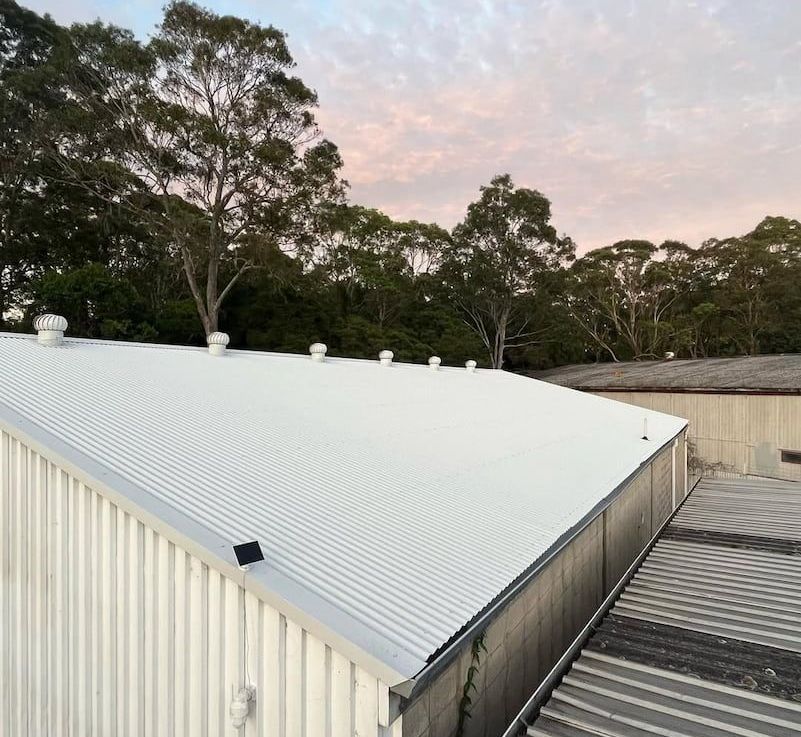 A Couple of People Are Working on a Roof — Metal Roofing by Matt Dwyer in Gerringong, NSW
