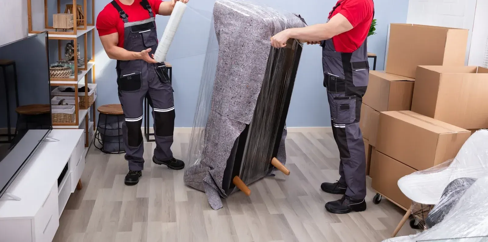 A room filled with lots of cardboard boxes and a ladder.