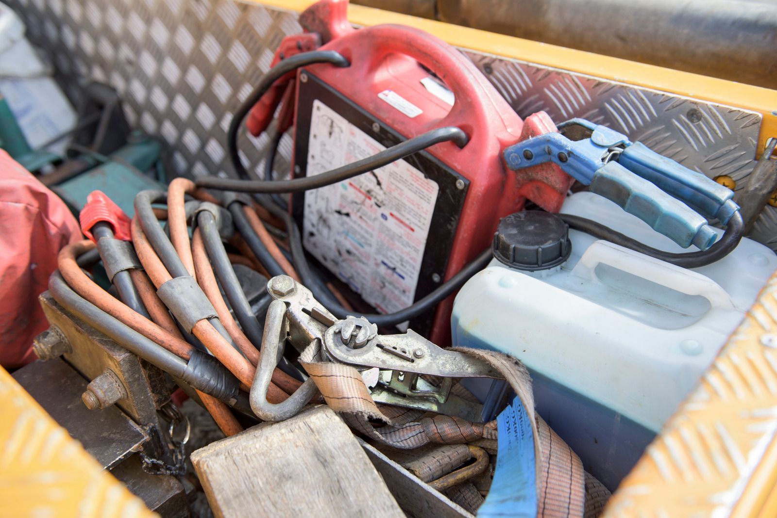 A bunch of tools are sitting in a box.