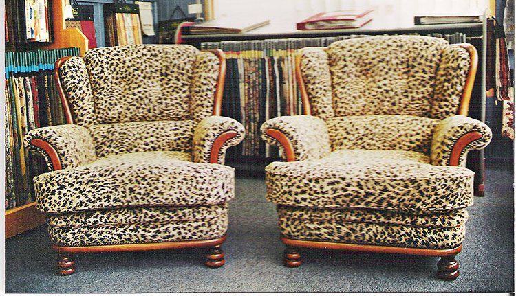 two dotted arm chairs
