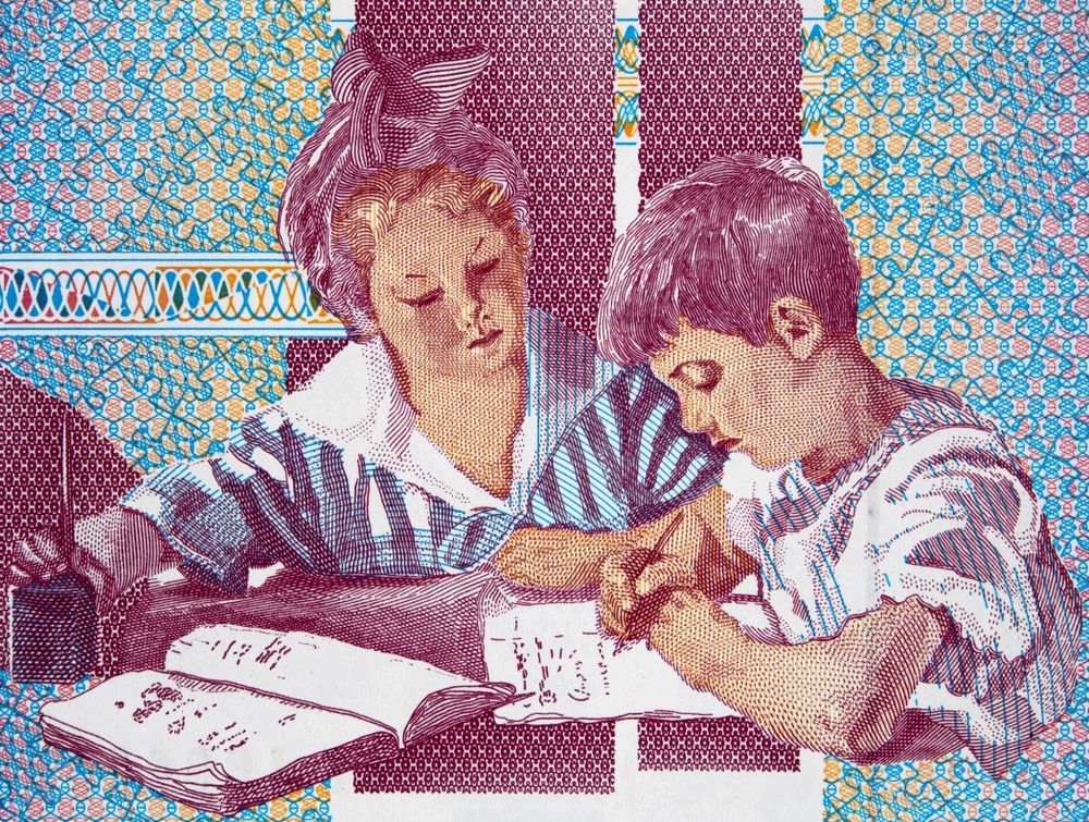 A painting of two children sitting at a table reading a book.