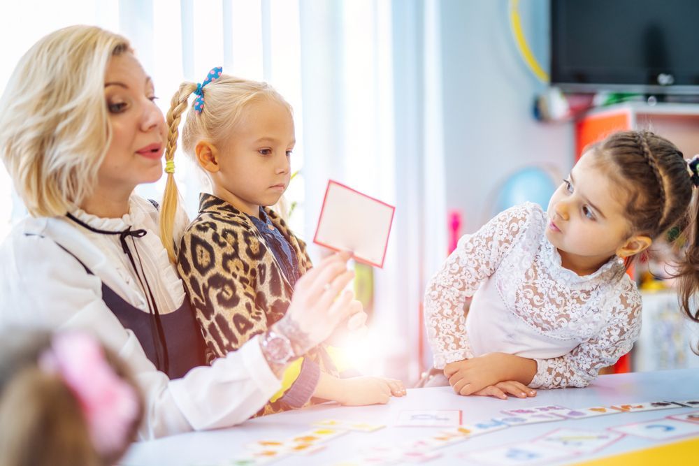 A teacher and her students are going over social-emotional learning activities.