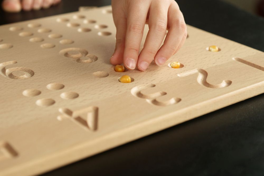 preschooler counting using Montessori one-to-one correspondence 