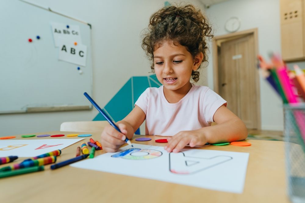 A young montessori girl learning the alphabet 