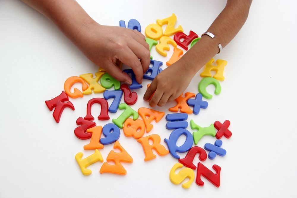 Montessori student working on sentence analysis.
