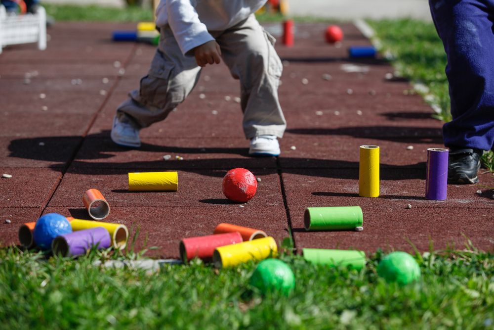 a child playing in an outdoor montessori classroom