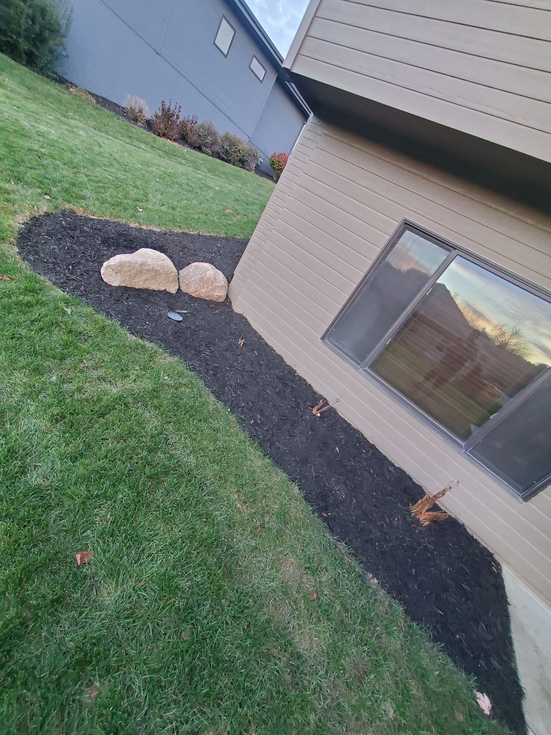 A person is standing in front of a house.