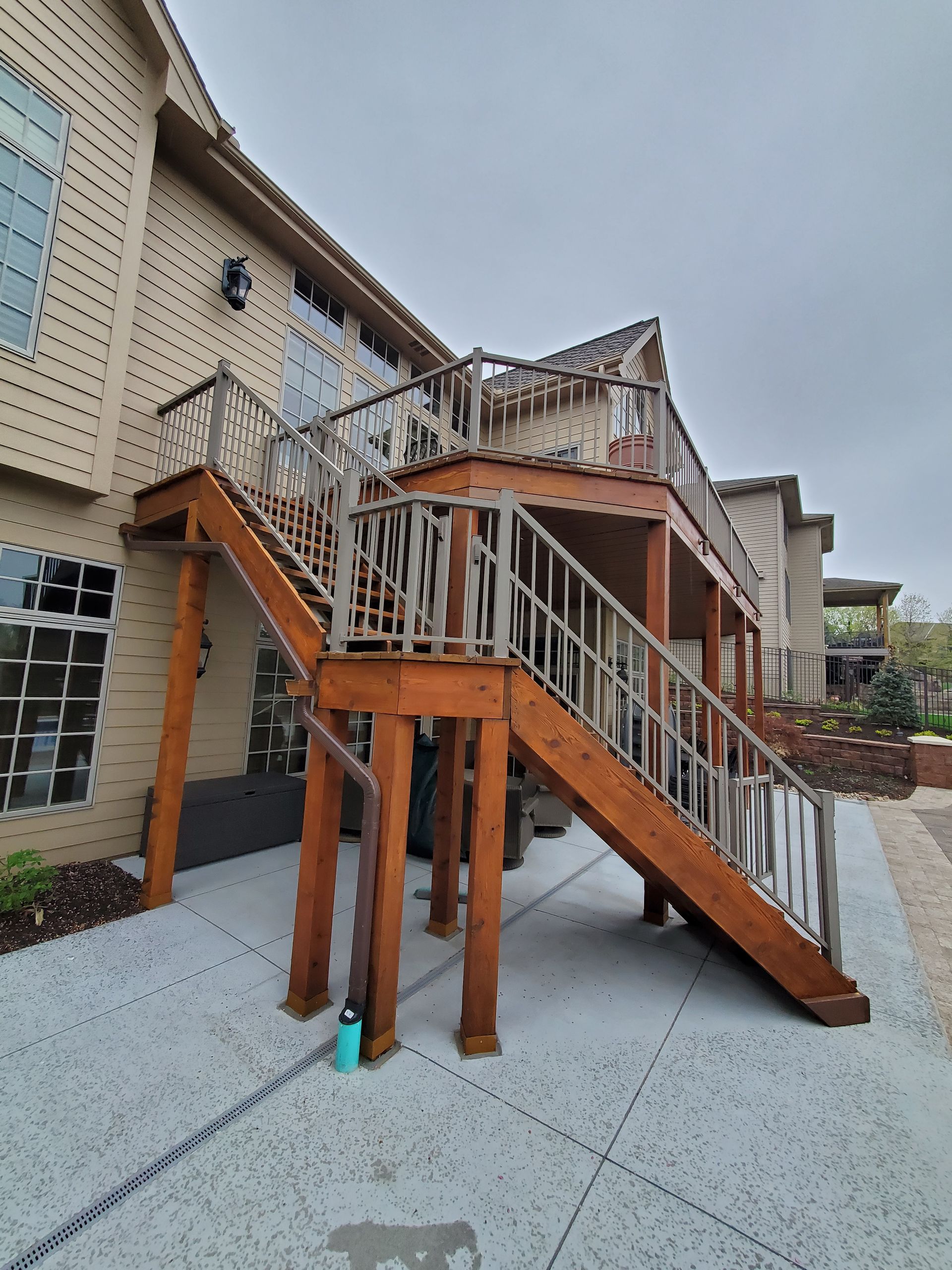 A large wooden deck with stairs leading up to it