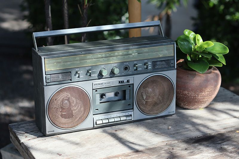 Radio on bench with plant