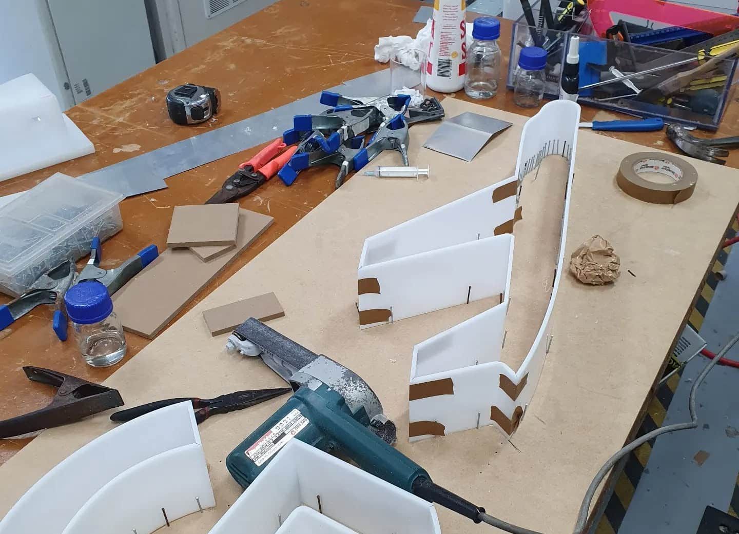 A Wooden Table With a Lot of Tools on It — Coastal Plastics In Tweed Heads South, NSW