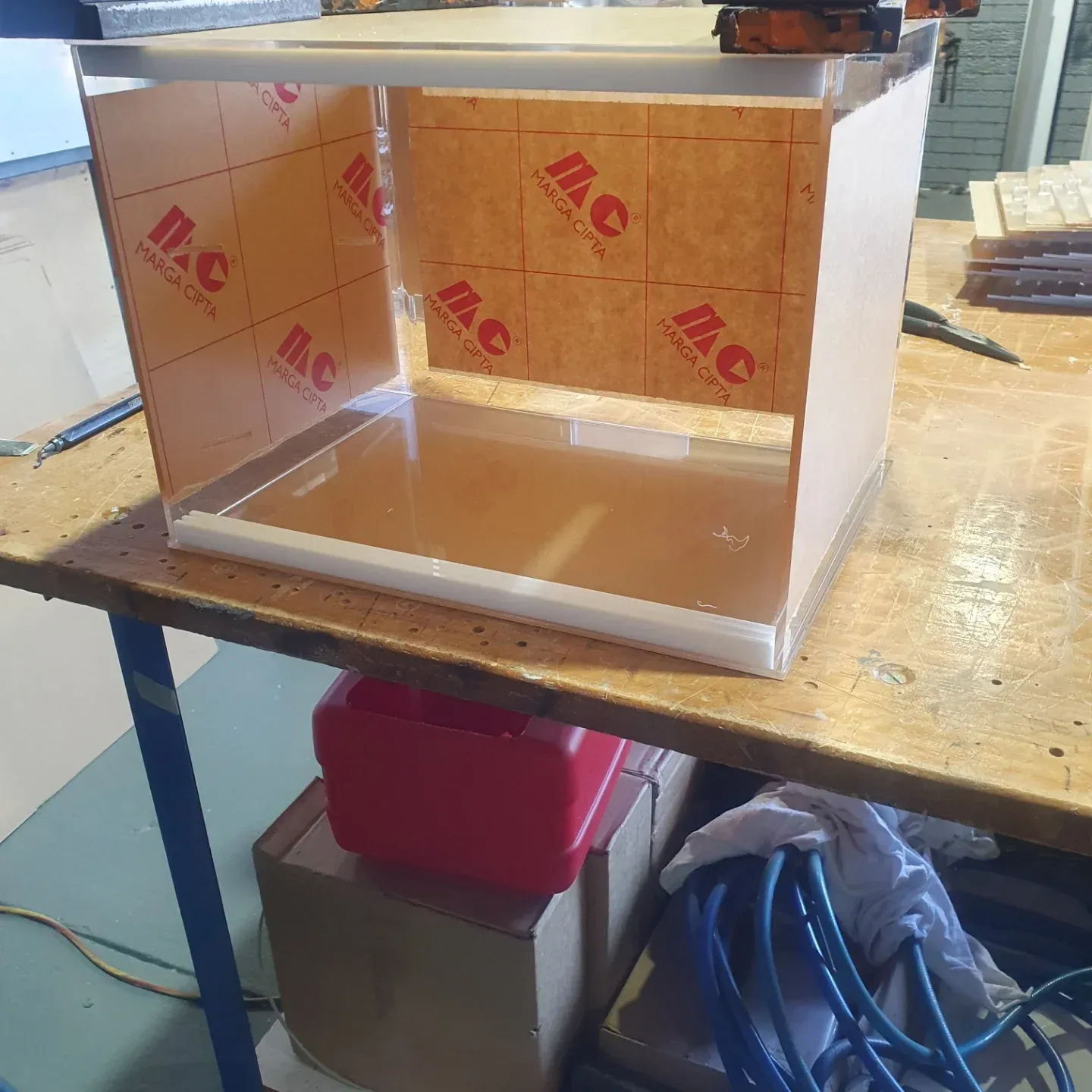 A Piece of Acrylic Sitting on Top of a Wooden Table — Coastal Plastics In Tweed Heads South, NSW
