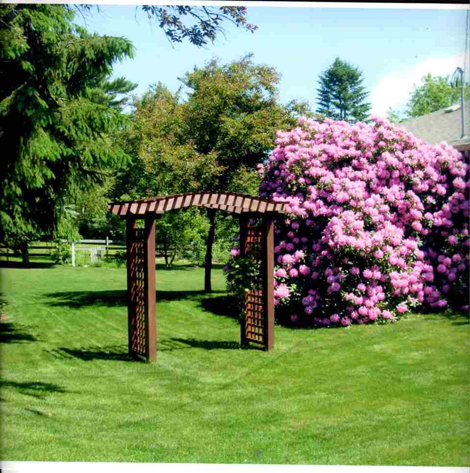 Wooden Arbor Near the Flowers — Barrington, NH — 125 Maintenance & Fence Inc