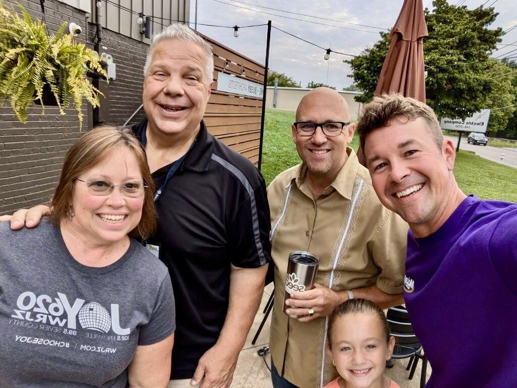 A group of people are posing for a picture together.