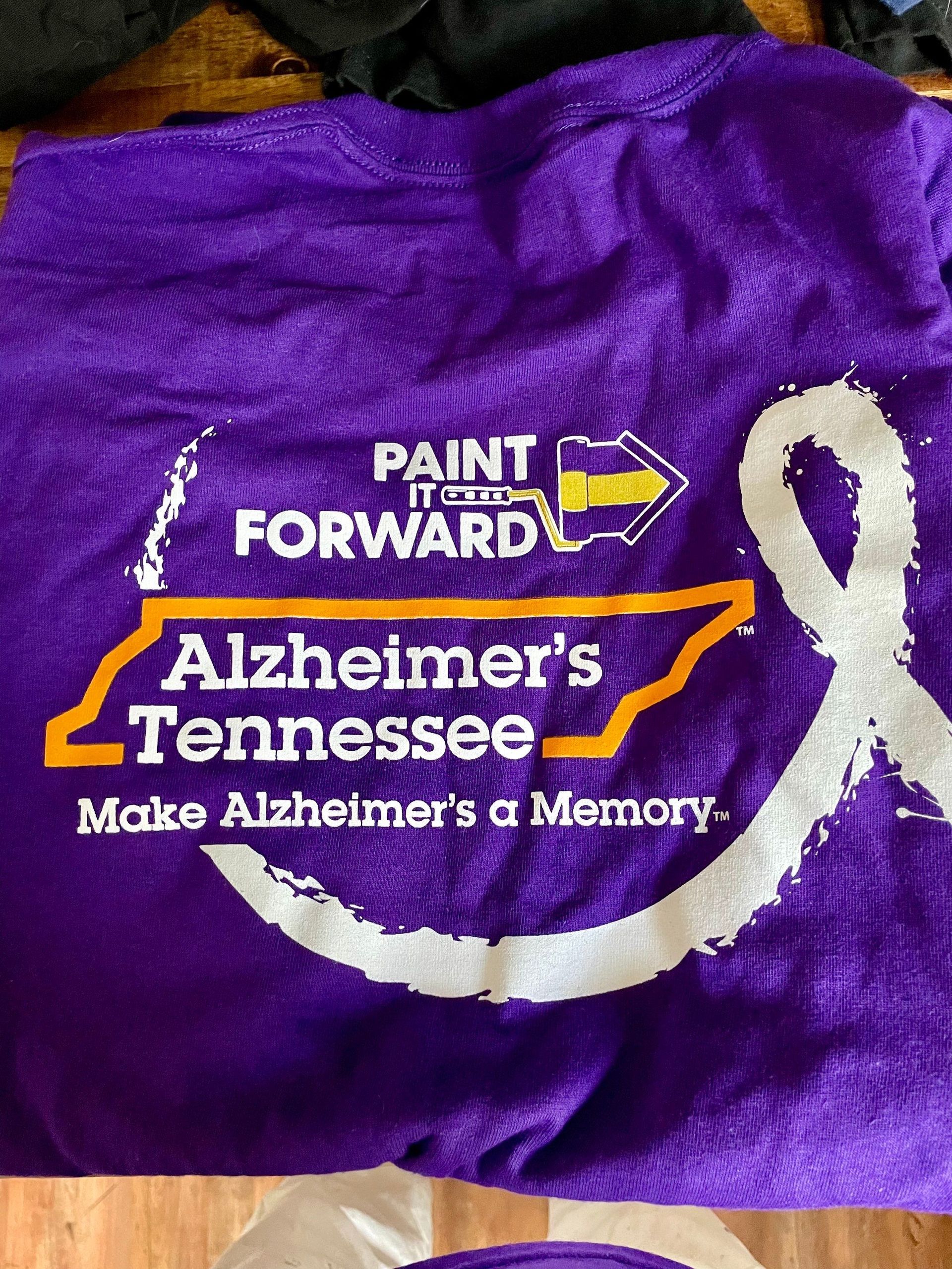 A purple shirt that says paint it forward alzheimer 's tennessee make alzheimer 's a memory