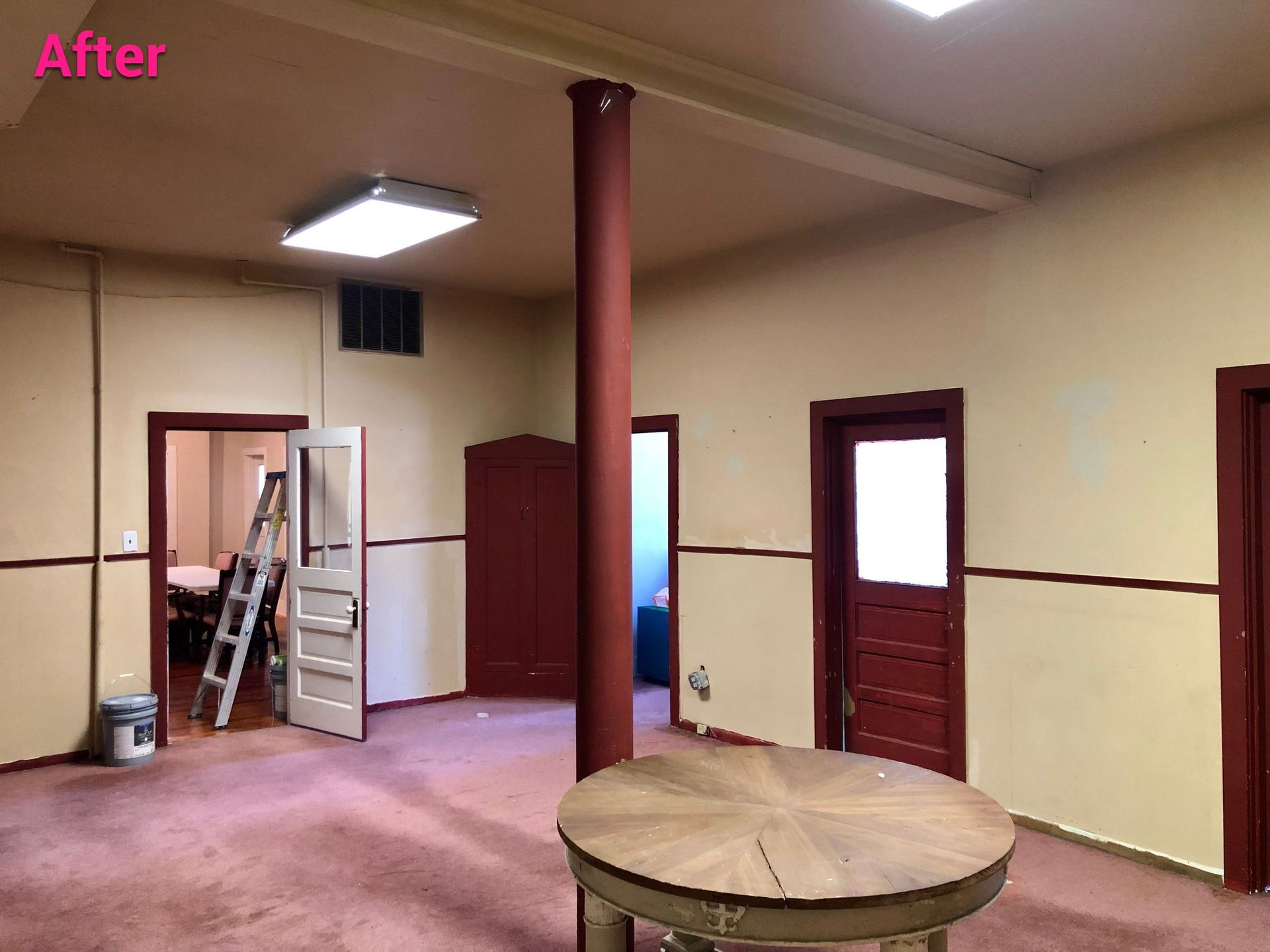 A room with a round table and a ladder and the words after on the bottom