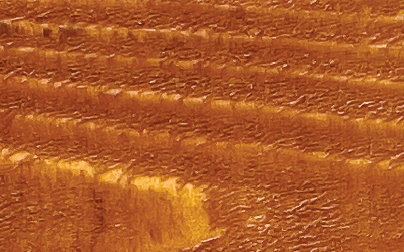 A close up of a piece of brown wood.