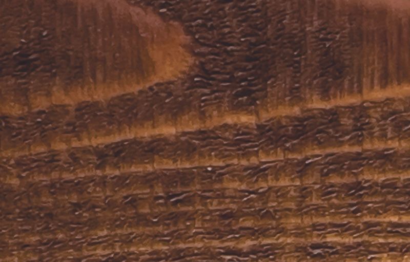 A close up of a piece of brown wood.