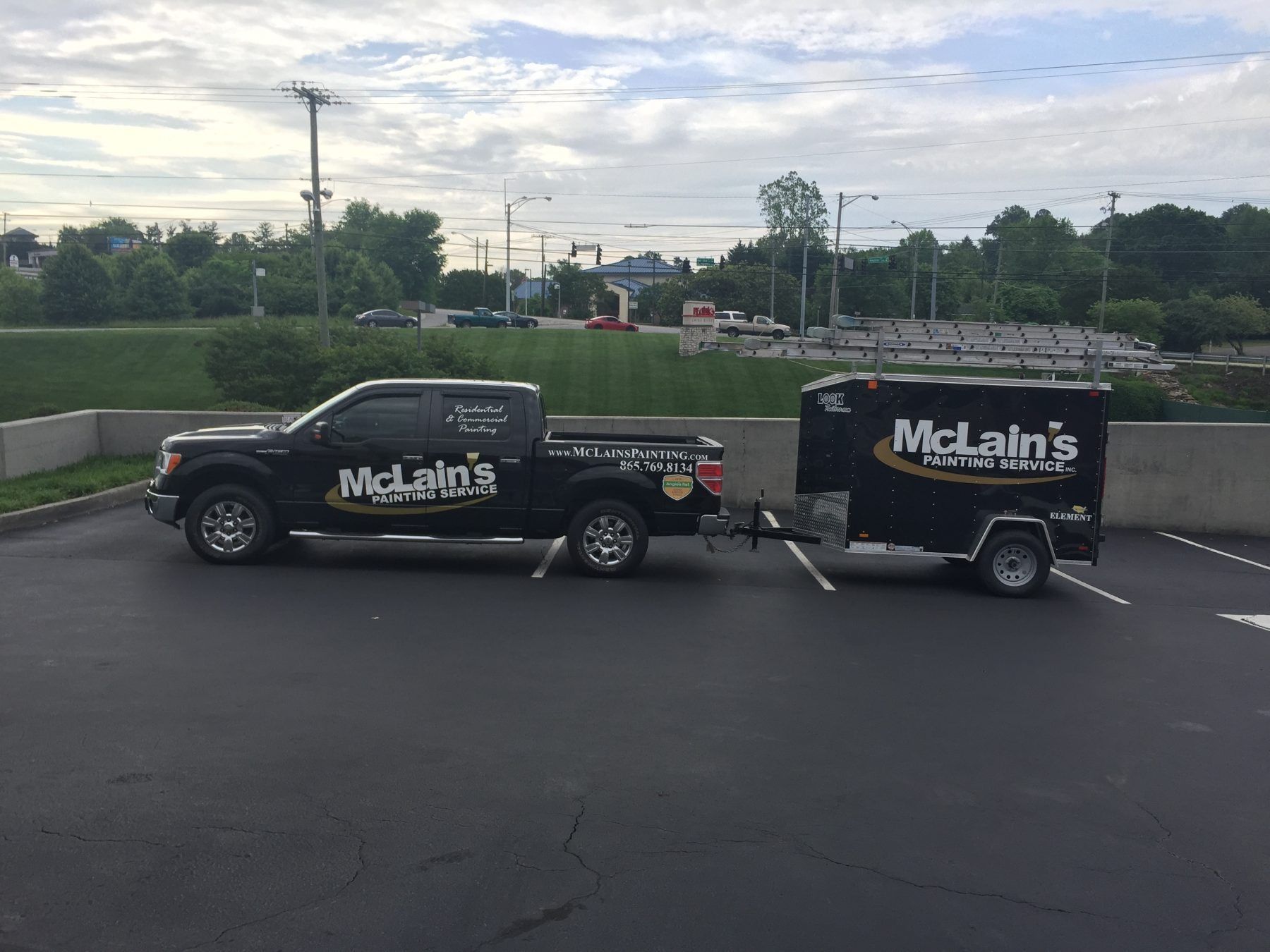 McLains Painting Services work truck and trailer