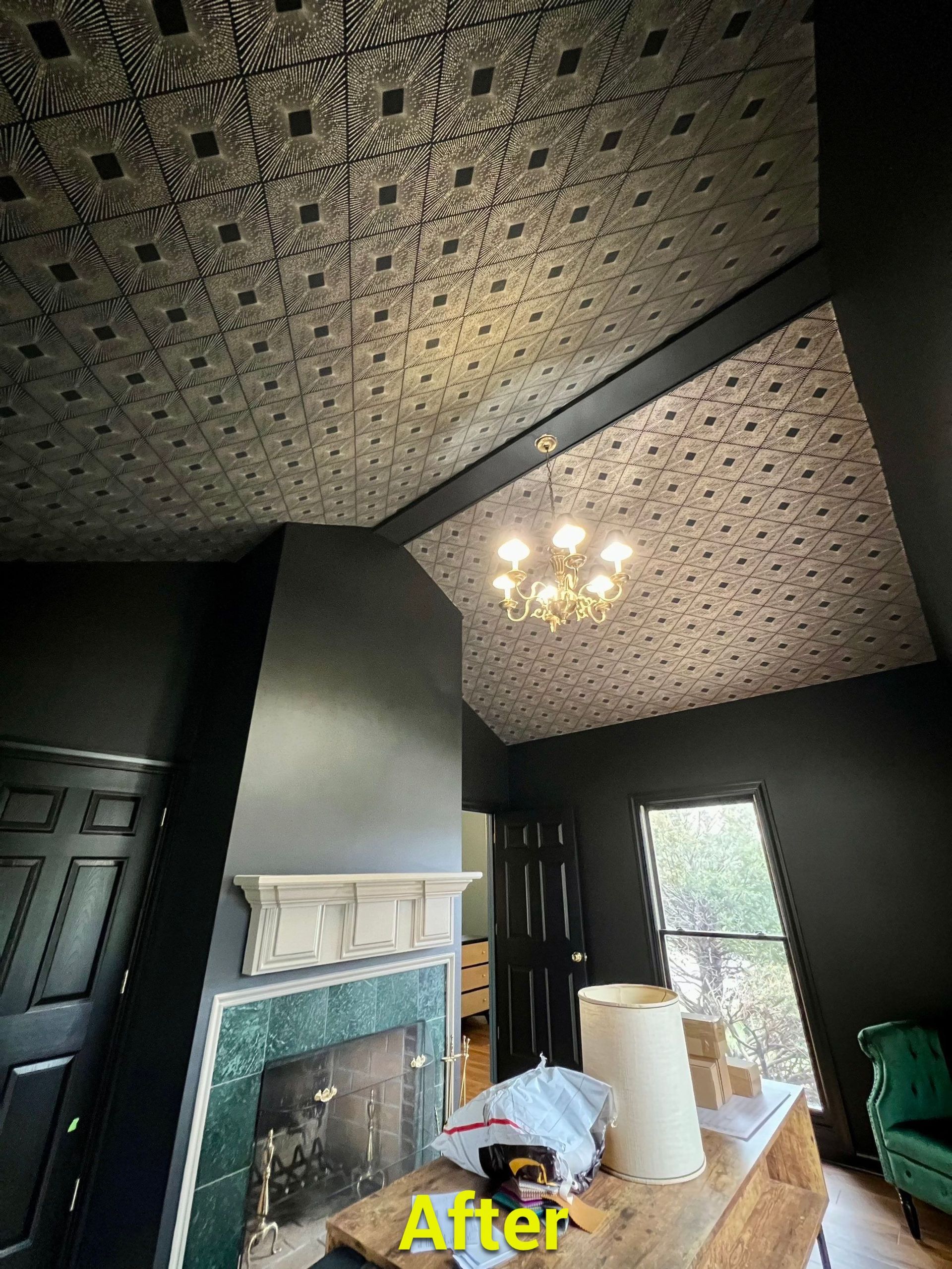 A living room with a fireplace and a ceiling that has been painted.