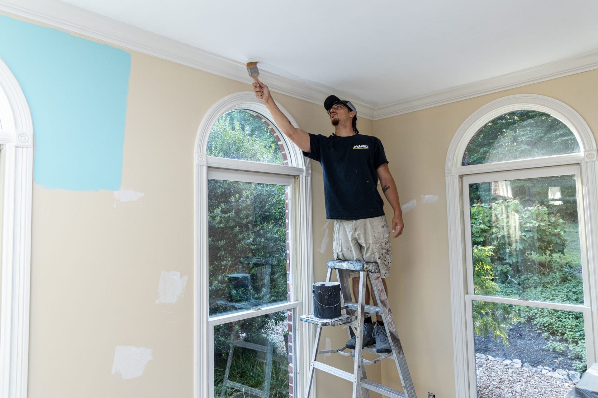McLains employee paints home interior