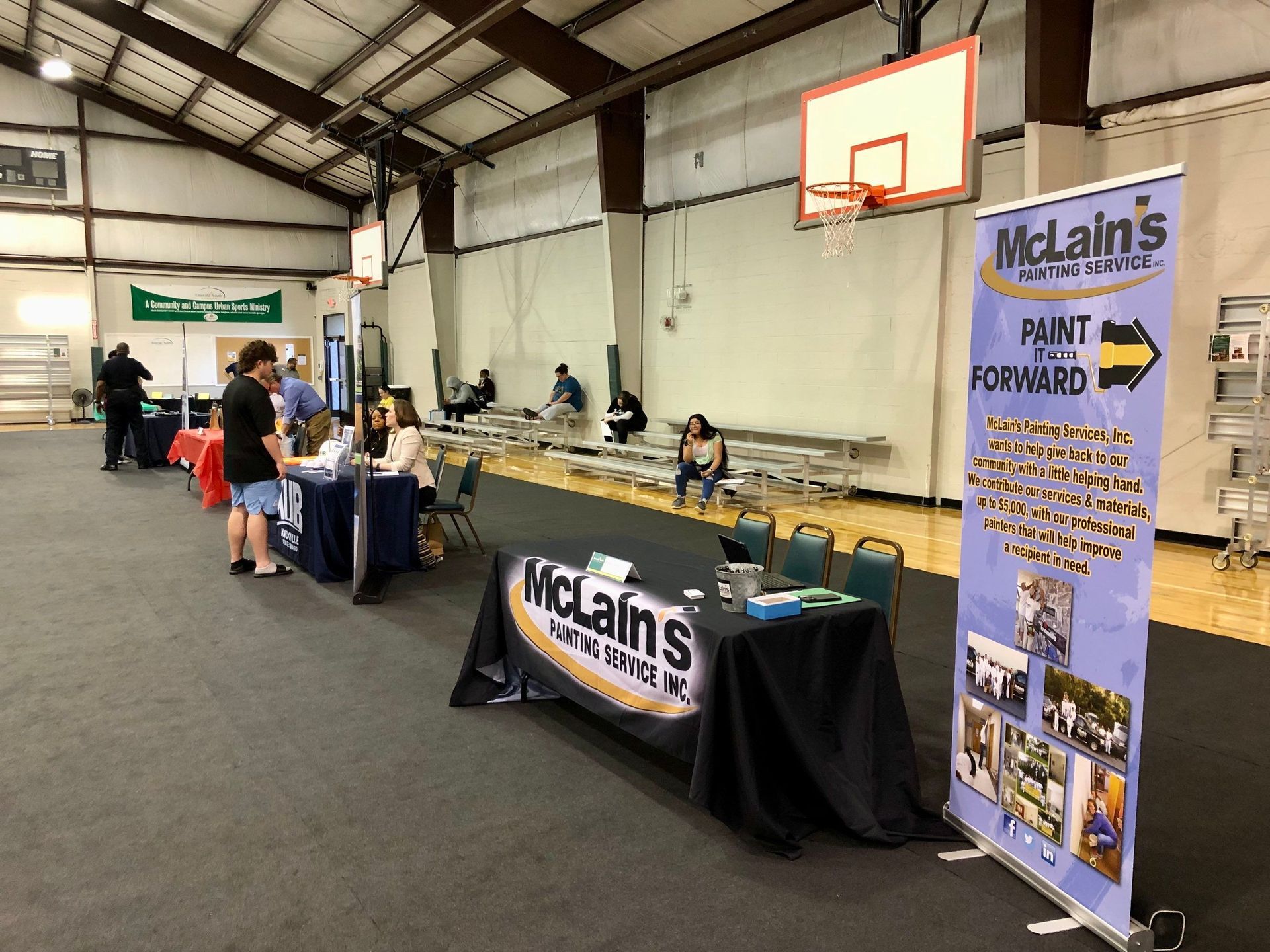 A table with a sign that says mclain 's on it