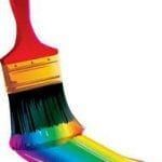 paintbrush with rainbow paint on bristles