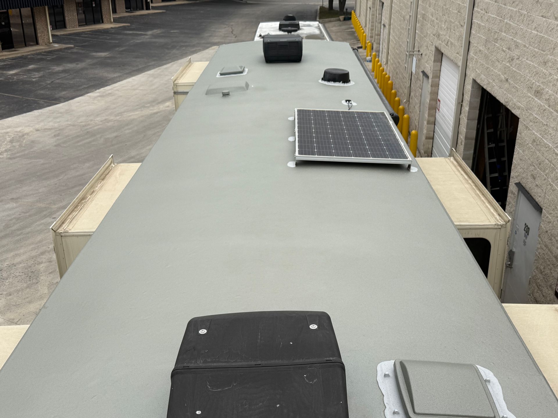 A roof with a solar panel on top of it