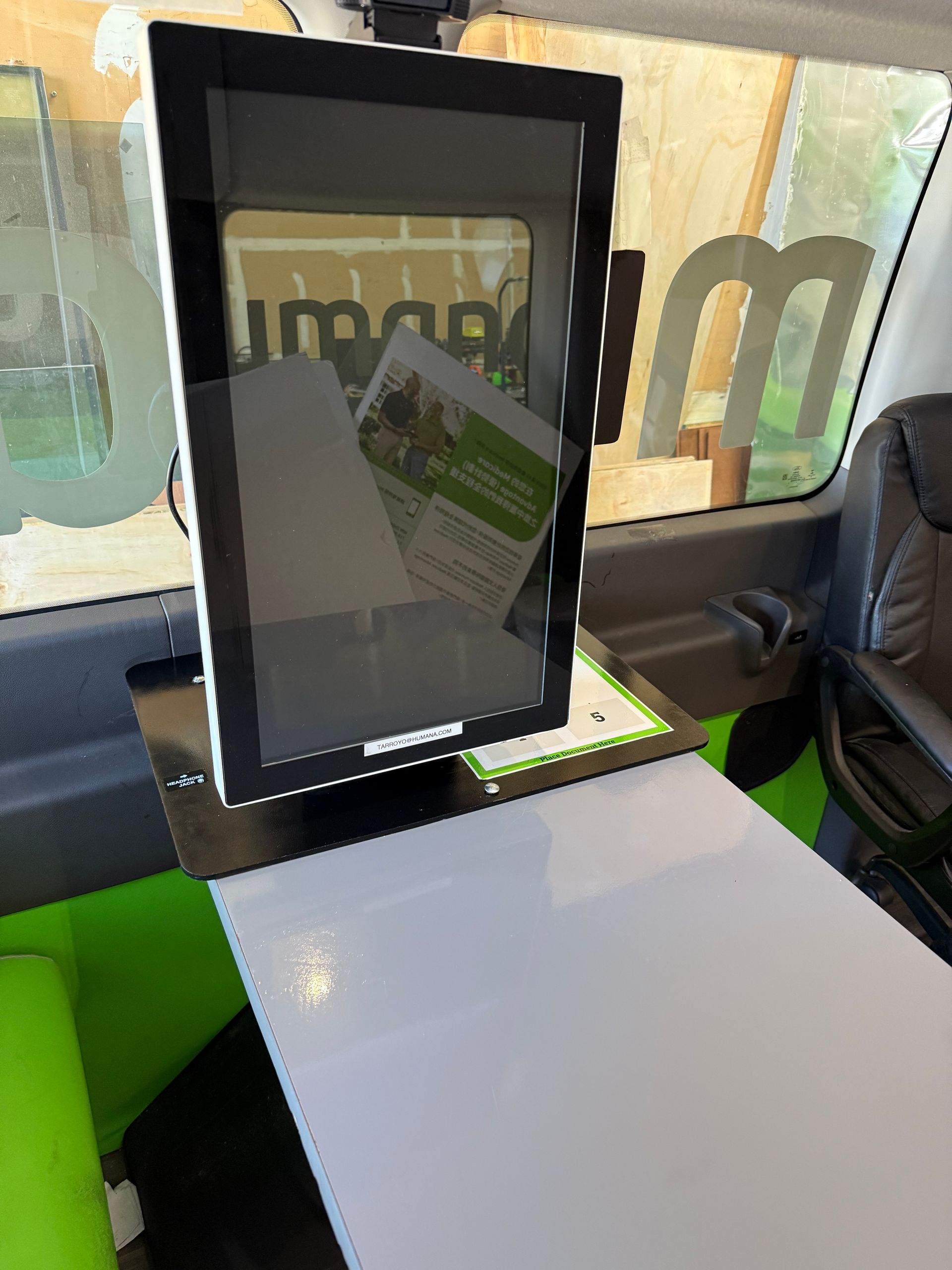 The inside of a van with a stable and newly installed kiosk for Humana Health Insurance company