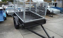 A Trailer With A Cage On The Back Is Parked In A Parking Lot – North Geelong, VIC - F Sparks & Sons