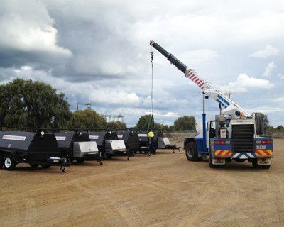 A Crane Is Sitting On Top Of A Truck In A Parking Lot – North Geelong, VIC - F Sparks & Sons