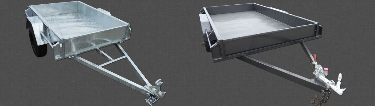 Two Trailers Are Sitting Next To Each Other On A Black Background – North Geelong, VIC - F Sparks & Sons