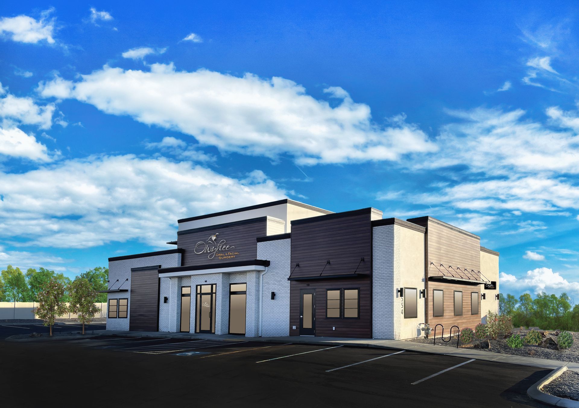 A large building with a blue sky and clouds in the background