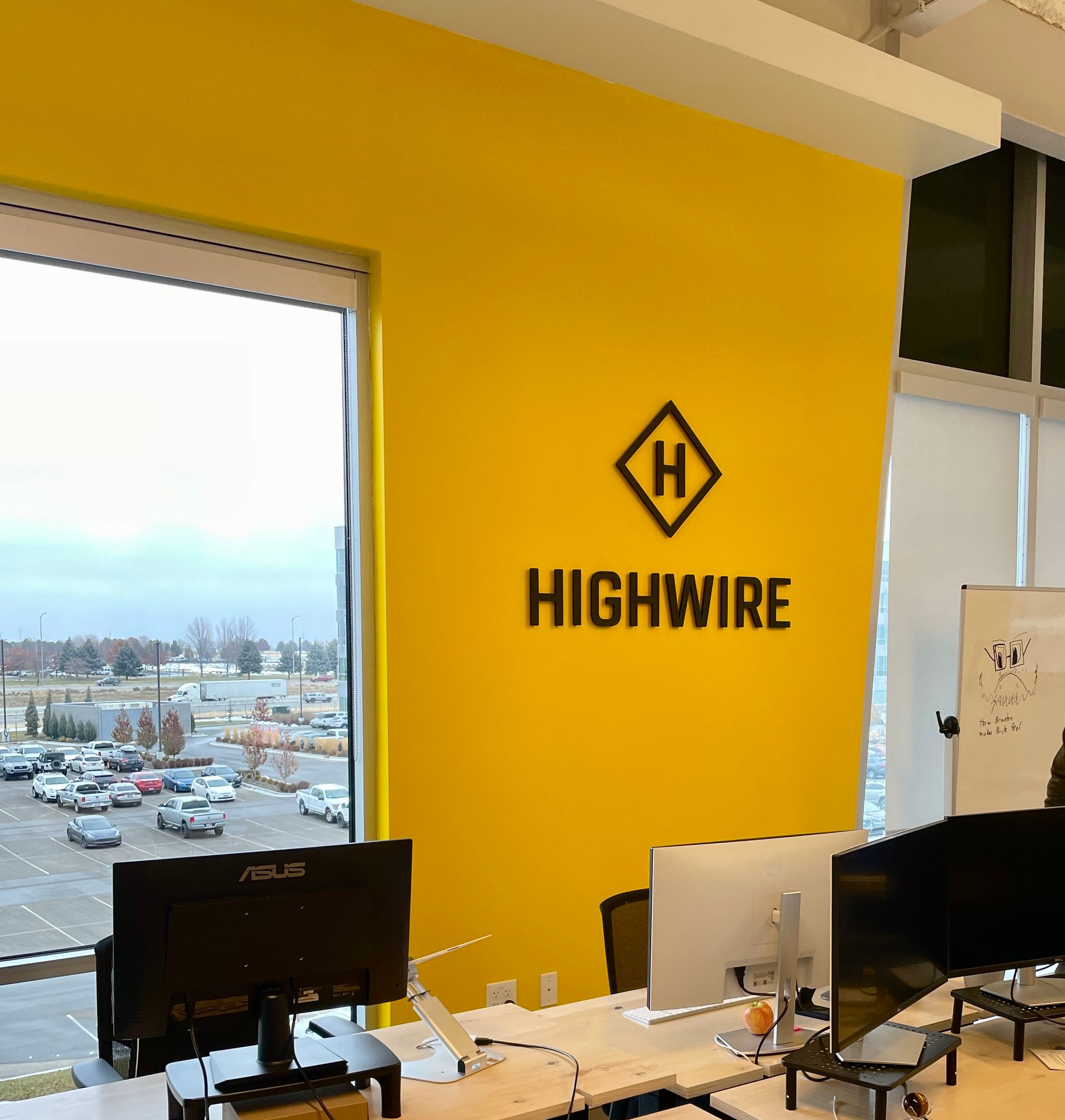 A yellow wall with the word highwire on it