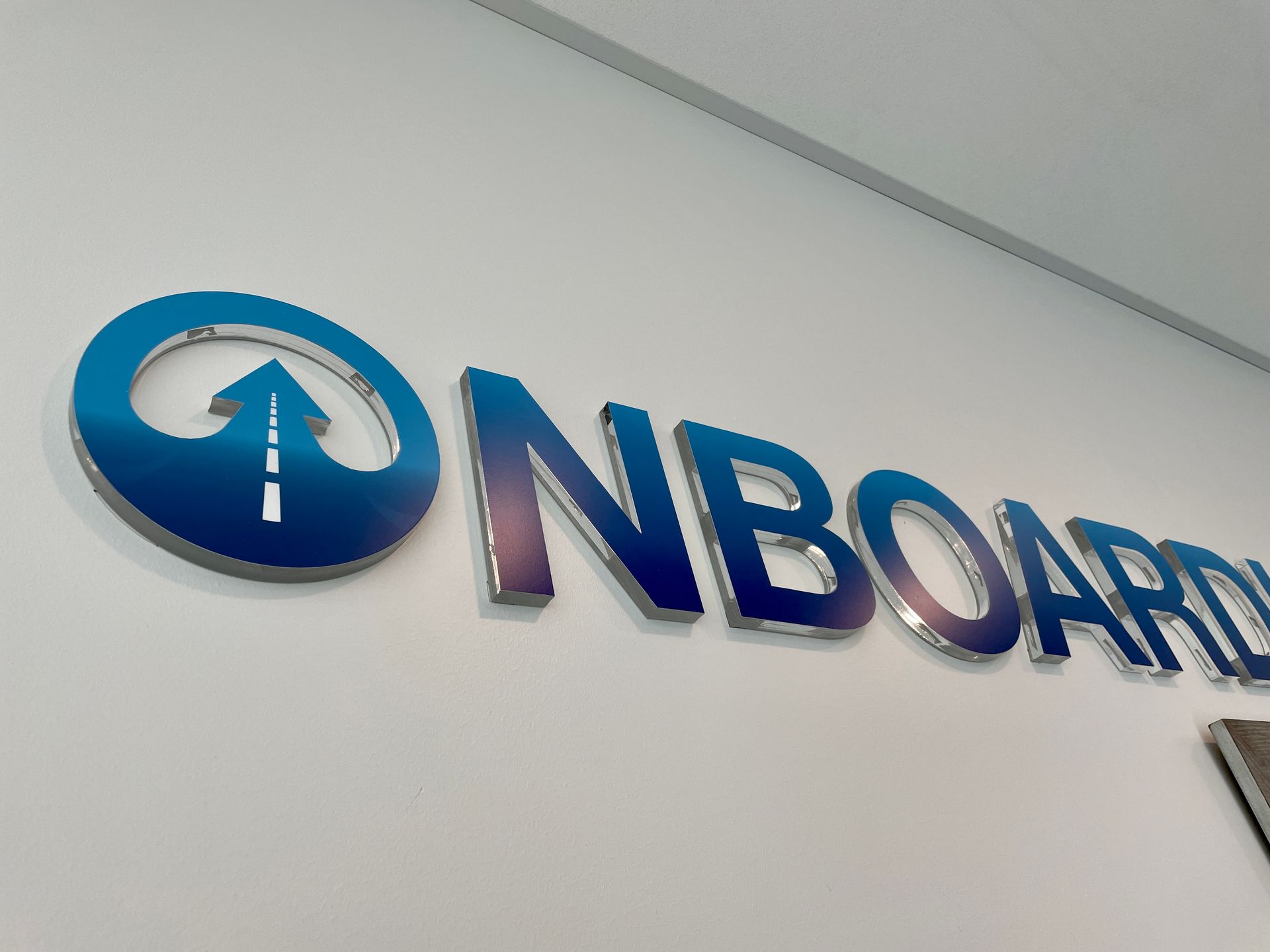 The word onboard is on a white wall