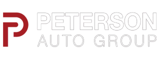 The peterson auto group logo is red and white on a white background.