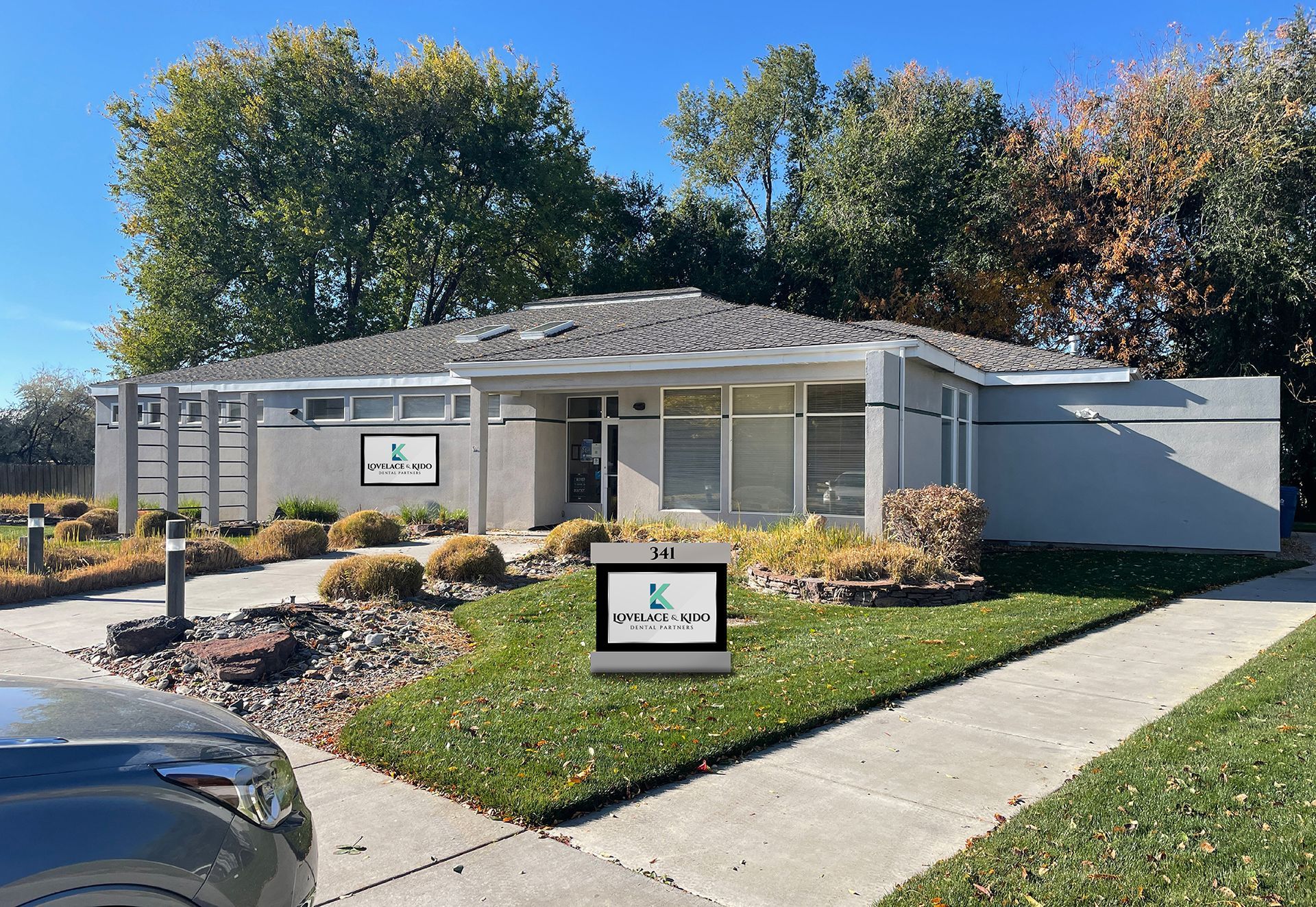 A house with a for sale sign in front of it
