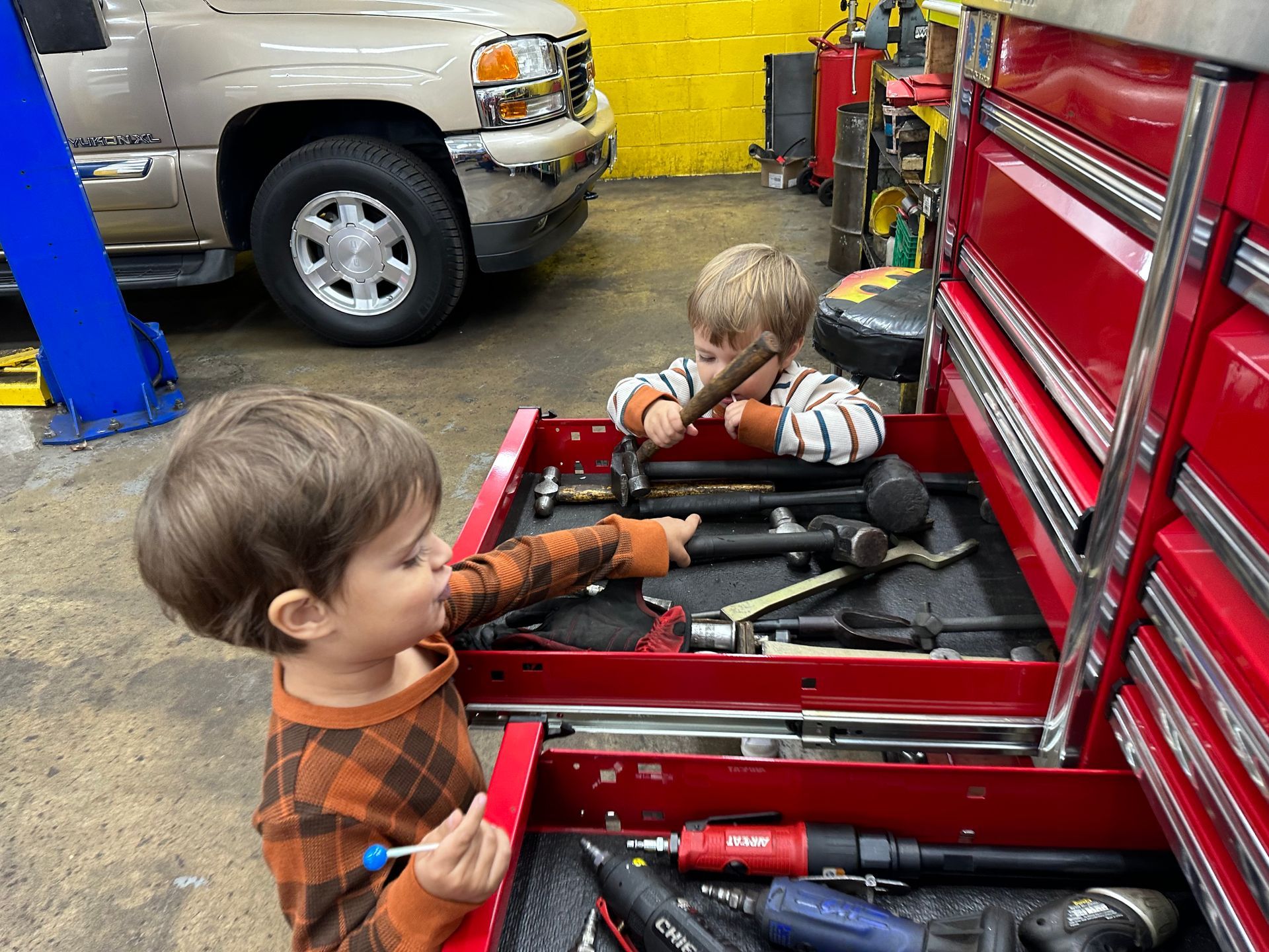 Kid Checking Our Tools - Golden Gears Automotive Inc