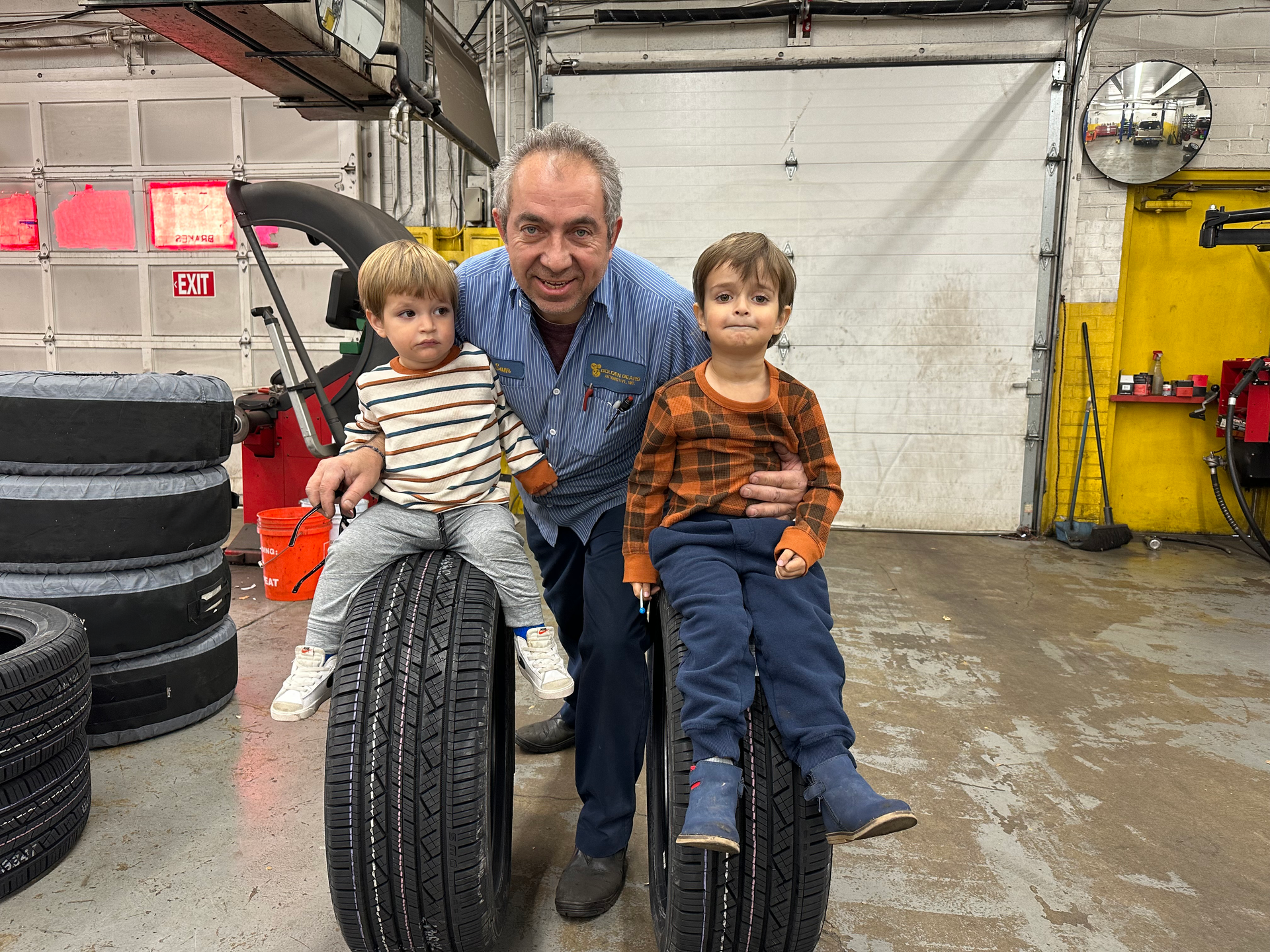 Technician with Kids at Golden Gears Automotive Inc - Rockville Auto Repair
