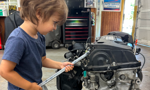 KId Working on Engine in Rockville, MD - Golden Gears Automotive Inc