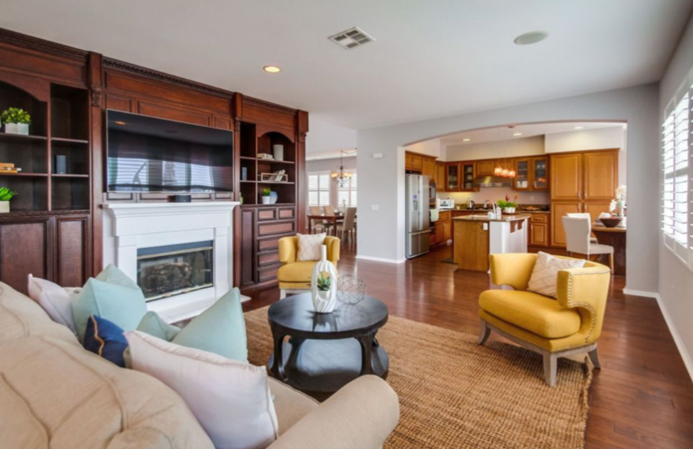 Warm living room interior with wood accents and comfortable seating.